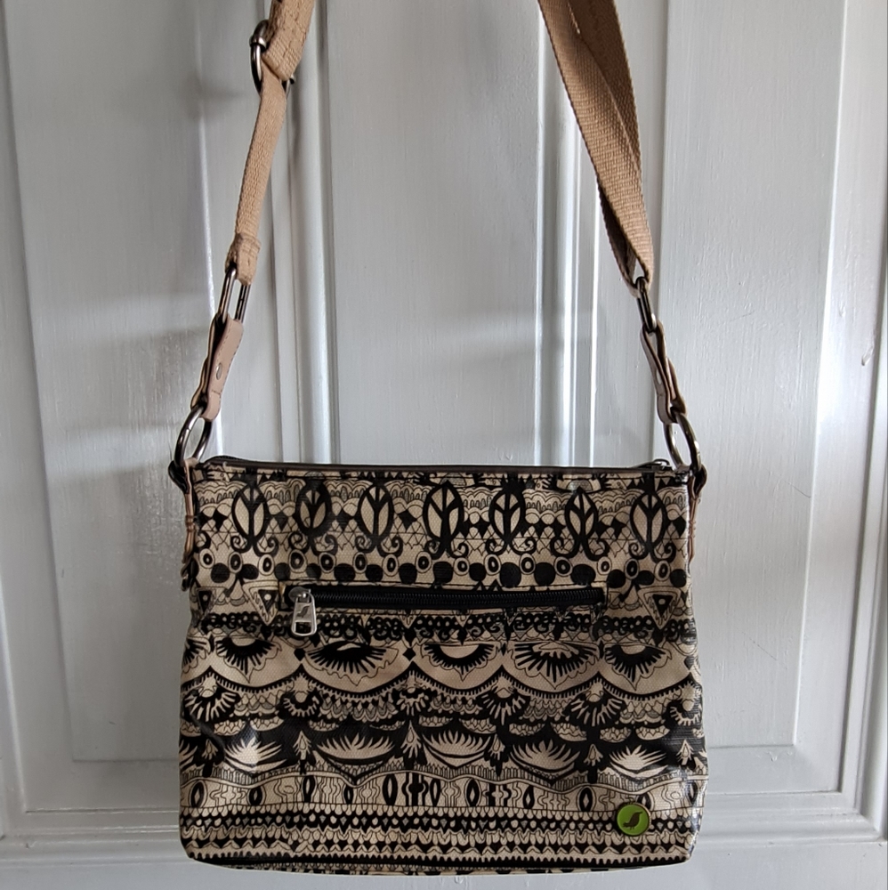 Sakroots artist circle crossbody bag peace sign cream and black